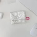 Detailed view of quilted white bow coin purse with pink lanyard for earbuds storage - Bow Quilted Beige Square Sanitary Pad Bag