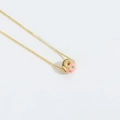Chic gold necklace featuring a pink donut pendant with colorful sprinkles detail - Pink Donut