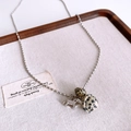 Detailed close-up of a silver pony pendant and spotted stone beads on a dainty bead chain - Silver Horse Pendant with Spotted Stone