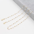 Golden eyewear chain with white heart-shaped pearls and secure lobster clasp closure - Heart Charm & Metal Bead
