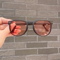 Detail of round foldable kids sunglasses with UV400 protection and matte black frames - Pink