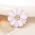 Macro detail of a white enamel flower charm with golden edges and crystal center - Rhinestone Center Flower / White