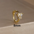 Macro shot of 8mm gold butterfly huggie hoop earring with S925 hallmark detail - 8mm / Gold-White