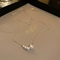 Minimalist gold necklace featuring four graduated freshwater pearls on a delicate chain - Real Gold Plated 4 Gradient Faux Pearls Style