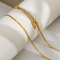Detail of golden snake bone chain necklace with lobster clasp and S.Steel hallmark - 2mm Width 40cm Length / Gold