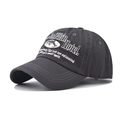 Detail of grey washed cotton baseball cap with white Dolphin Hotel 3D embroidery - Adjustable / Gray