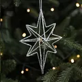 Stella di Natale argento glitterata da 15cm appesa all'albero con calda luce bokeh - Grande Stella a 8 Punte Argento