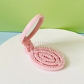 Portable pink folding hairbrush with integrated mirror for travel and daily massage - Pink