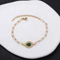Vintage gold stainless steel bracelet featuring an oval green malachite centerpiece - Green Malachite