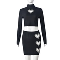 Close-up of heart-shaped cutout with silver rhinestones on ribbed knit fabric - S / Black