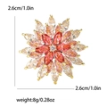 Broche flocon de neige rotative élégante avec zircons rouges et dorure brillante - Rose