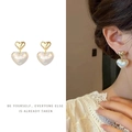 Close-up of double layered heart earrings with golden studs and iridescent heart charms - Mermaid Iridescent Heart Clip-on