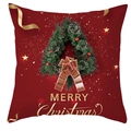 Détail du motif de couronne de Noël et texte Merry Christmas doré sur la taie de coussin - Couronne Rouge Joyeux Noël