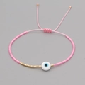 Dettaglio del bracciale di perline Miyuki rosa con un ciondolo centrale Malocchio - Rosa (MI-B200498L)