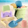 6-piece macaron kids beach toy set with sand bucket and tools on a sunny beach - Green Beach Bucket 6-Piece Set (Random Shape and Colors)