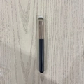 Single makeup brush with black handle and silver ferrule on light wood background - Plastic Handle 270 Concealer Brush