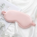 Pink silk sleep mask with elastic strap on white fabric background with pearls - Gold-Pink Eye Mask