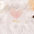 White greeting card with pink gradient heart and golden Thank You text on plush background - Thank You (Light Orange)