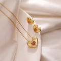 Close-up of gold heart pendant necklace and earrings set with red zircon inlay - Red Zirconia Heart Necklace and Earrings Set