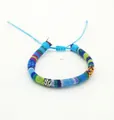 Detail of bohemian hand-woven colorful surfgrip bracelet with adjustable cord - US 11