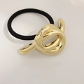 Minimalist golden knot hair tie with black high-elastic band for elegant ponytails - Knotted Style Gold