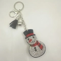 Close-up of snowman keychain with rhinestones, silver bell and black tassel detail - Snowman Style 1