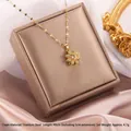 Goldene Sonnenblumen-Kette mit Zirkonia aus Titanstahl auf Schmuckschatulle liegend - Drehende Blume Stil E (A220)