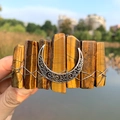 Detail of yellow tiger eye stone hair clip with a silver crescent moon charm accessory - Tiger Eye + Moon