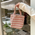 Detailed close-up of tulip print corduroy tote bag with pink straps and metal snap button - Little Red Flower