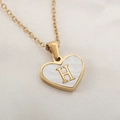 Golden heart necklace with white shell inlay featuring a serif letter H pendant - Letter H