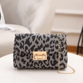 Classic shoulder bag featuring black and white leopard print fabric with golden chain strap - Leopard Print Black