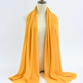 Vibrant yellow chiffon shawl scarf elegantly draped on a professional model mannequin - 55