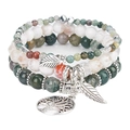 Detail of Tree of Life and feather charms on bohemian multi-layered beaded bracelets - India Agate