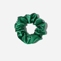 Macro detail of dark green satin scrunchie showing glossy silk texture and pleated design - Verdant