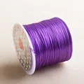 Flat purple elastic crystal cord on a spool for handmade jewelry and beading - Purple