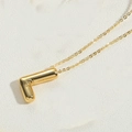 Polished 14K gold plated necklace featuring a 3D letter L pendant on a fine cross chain - Letter L