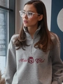 Close-up of grey half-zip sweatshirt featuring red Moda Club embroidery and soft fleece texture - S / Thin Style / Light Gray
