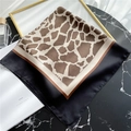 Chic 70cm square satin neck scarf featuring a brown giraffe print and black borders - Leopard Brown
