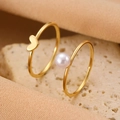 Minimalist gold rings set featuring a soft pink pearl and polished heart-shaped charm - Smooth Pearl Heart Ring Set (F011)