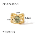Detail of 18k gold plated braided ring featuring a green turquoise stone inlay - Adjustable Open / Green Spotted Stone Style (CP-R24003-3)