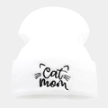 Close-up of Cat Mom embroidery and black cat whiskers on a white knitted beanie hat - One Size / White