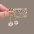 Pince à queue de cheval dorée avec strass brillants et pendentifs en perles - Dentelle Creuse Strass / Or