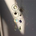 Golden sun and moon crystal suncatcher with prisms creating rainbow light reflections - Number 2