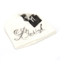 Close-up of white ribbed knit beanie featuring black gothic letter and street style print - One Size / White