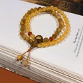 Close-up of double-loop beaded bracelet with amber yellow beads and lotus wood decor - 28# Lotus Citrine Gold Tiger Eye Bracelet - Gift Box