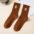 Deep brown ribbed cotton crew sock featuring a white knitted letter C in vintage style - Tan