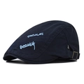 Detail of navy cotton beret featuring light blue beauty embroidery and adjustable metal buckle - Adjustable / Navy Blue