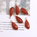 Faceted teardrop petal pendants in brownish-red with gold plated metal edging set - Goldstone (Synthetic)