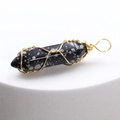 Snowflake obsidian hexagonal column pendant with gold wire wrapping on white base - Snowflake Obsidian