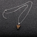 Detailed top view of a brown triangular tiger eye stone pendant on a silver metal chain - Tiger Eye Triangle